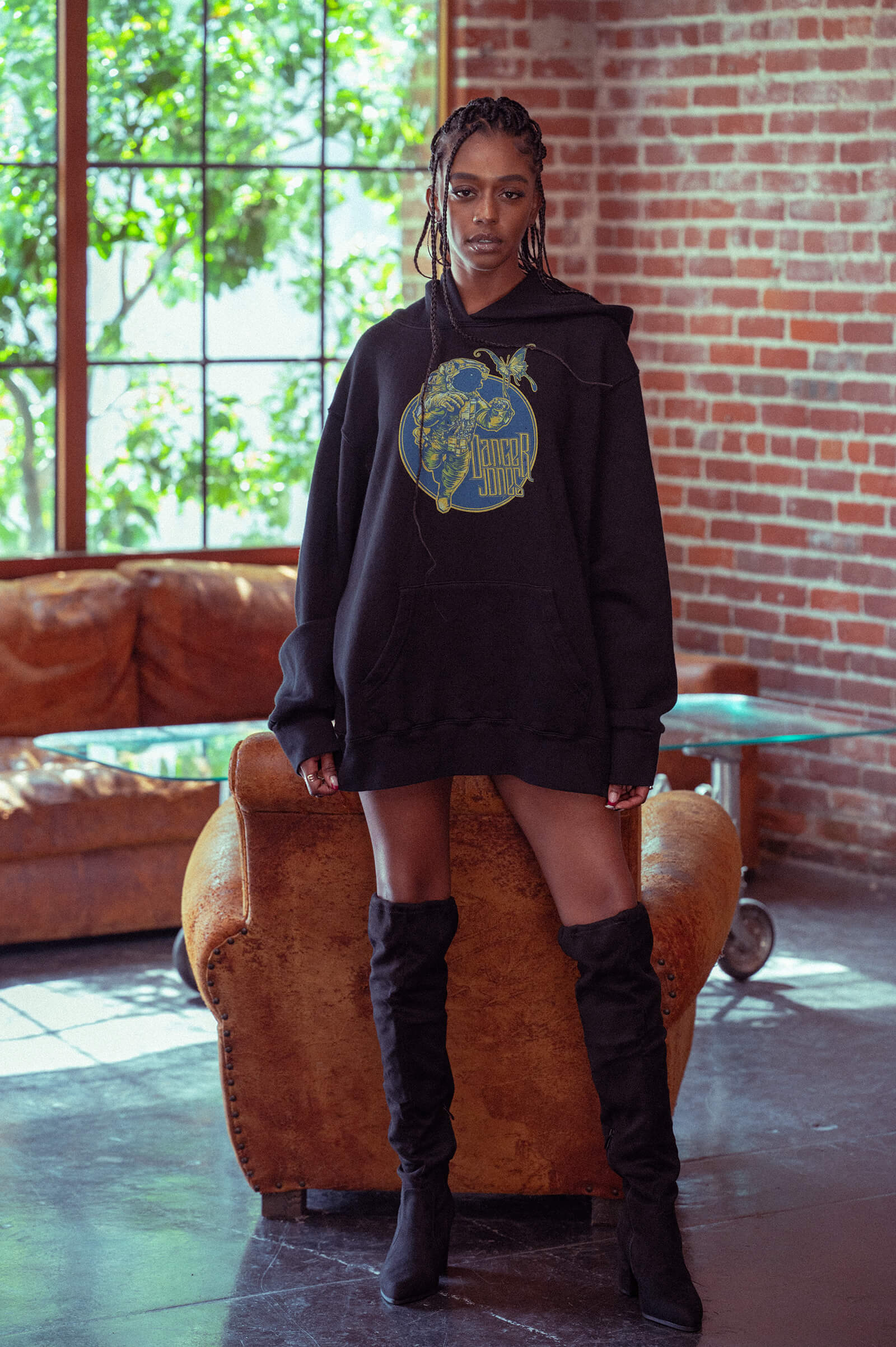 Model standing wearing a Danger Jones Starrider Hoodie Dress.
